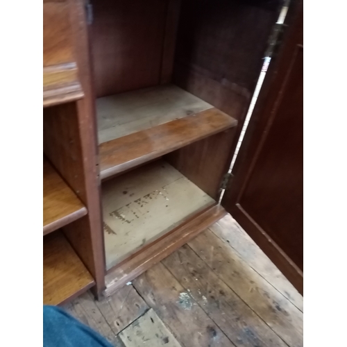 804 - A Victorian pollard oak bookcase, with a central frieze drawer above two open shelves flanked by a p... 