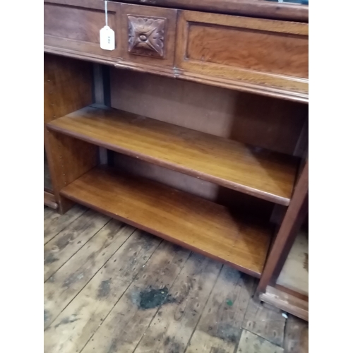 804 - A Victorian pollard oak bookcase, with a central frieze drawer above two open shelves flanked by a p... 