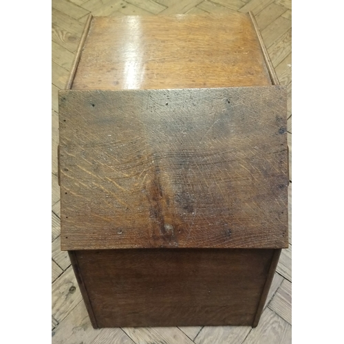 826 - A late 19th century oak trug, of tapering form with a turned fixed overhead handle, 60cm long