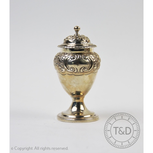 27 - A George IV sugar caster, Thomas Johnson I, London 1824, of baluster form, embossed with scrolling f... 