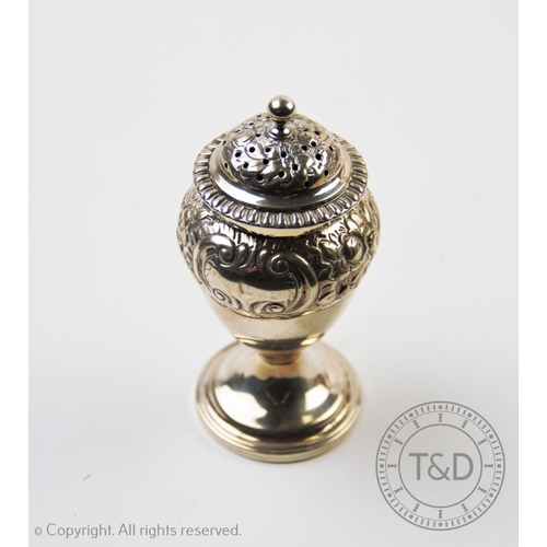 27 - A George IV sugar caster, Thomas Johnson I, London 1824, of baluster form, embossed with scrolling f... 