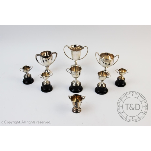 33 - A collection of miniature silver trophies, to include a George V example, Edward Barnard & Sons Ltd,... 