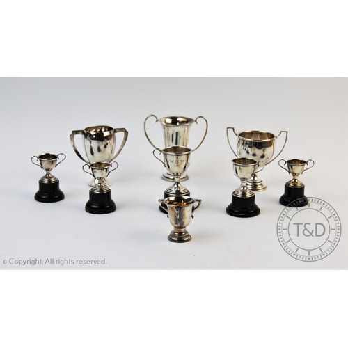 33 - A collection of miniature silver trophies, to include a George V example, Edward Barnard & Sons Ltd,... 