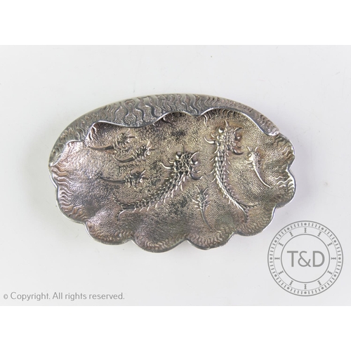 34 - An Egyptian silver dish, Cairo 1965-67, designed with stylized silver fish motif, a part scalloped r... 