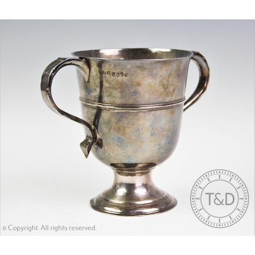 36 - A George III silver loving cup, Thomas Watson, Newcastle 1815, of plain polished form, with banded d... 