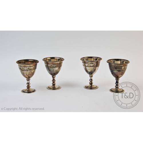 47 - A set of four Victorian silver egg cups, Walker & Hall, Sheffield 1878, each with chalice form bodie... 