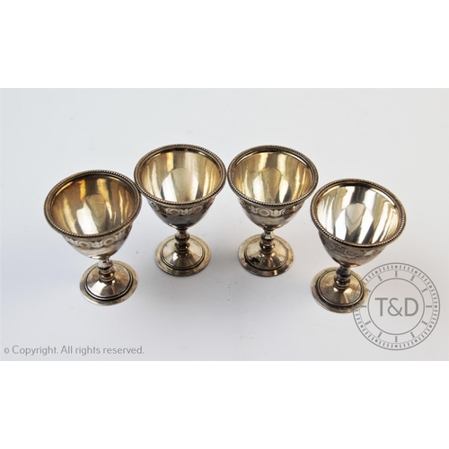 47 - A set of four Victorian silver egg cups, Walker & Hall, Sheffield 1878, each with chalice form bodie... 