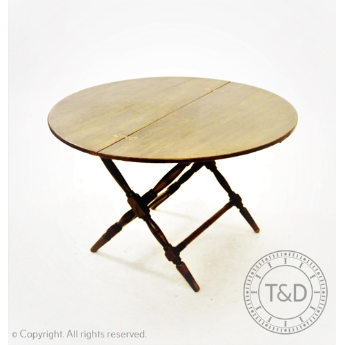 808 - A 19th century mahogany coaching table, the circular folding top with inset brass butterfly hinges, ... 