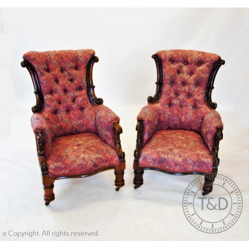 815 - A near pair of William IV mahogany framed armchairs, each chair with a padded button back flanked by... 