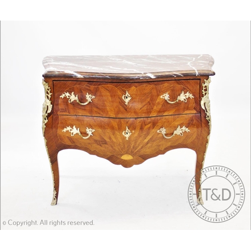 831 - A French Louis XVI style kingwood and ormolu mounted bombe chest of drawers, the serpentine marble t... 