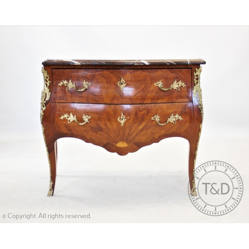 831 - A French Louis XVI style kingwood and ormolu mounted bombe chest of drawers, the serpentine marble t... 