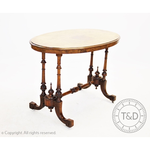 834 - A Victorian burr walnut inlaid oval occasional table, the quarter veneered moulded top inlaid with f... 