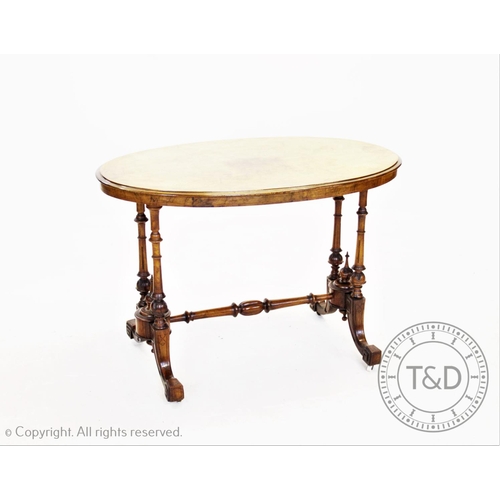 834 - A Victorian burr walnut inlaid oval occasional table, the quarter veneered moulded top inlaid with f... 