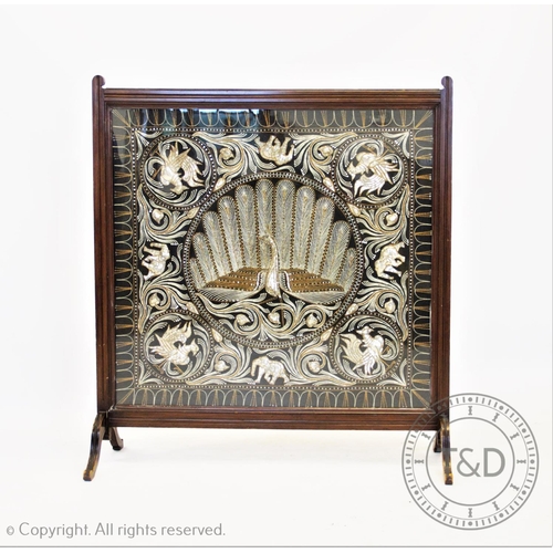 835 - A 20th century walnut framed needlework firescreen, the Indian style panel embroidered using silver,... 