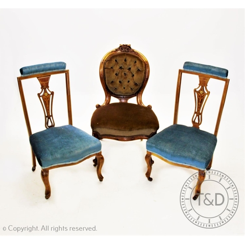 840 - A Victorian walnut framed balloon back nursing chair, with carved crest above an oval button back an... 