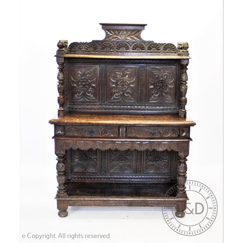 845 - A Victorian carved oak buffet/sideboard, the three panel back carved with flower heads below a shelf... 