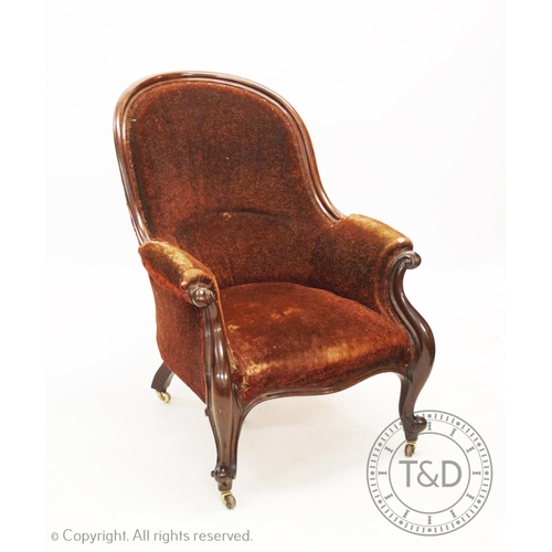 849 - A Victorian mahogany framed drawing room chair, the arched padded back above a serpentine seat flank... 