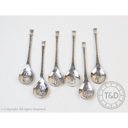 85 - A set of silver Christmas spoons, Franklin Mint, Sheffield 1979, each designed with a Victorian figu... 