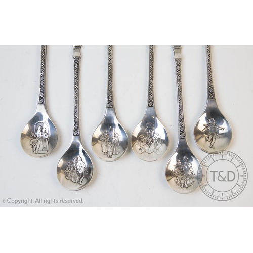 85 - A set of silver Christmas spoons, Franklin Mint, Sheffield 1979, each designed with a Victorian figu... 