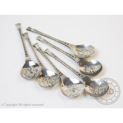 85 - A set of silver Christmas spoons, Franklin Mint, Sheffield 1979, each designed with a Victorian figu... 