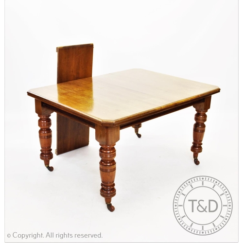 862 - An Edwardian walnut extending dining table, with one extra leaf, the rectangular moulded top with ca... 