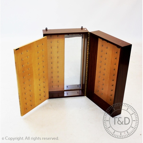 869 - A mid 20th century teak folding wall cabinet,with an inner hinged panel and mirror,applied with an a... 