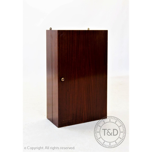 869 - A mid 20th century teak folding wall cabinet,with an inner hinged panel and mirror,applied with an a... 