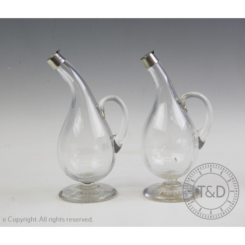 93 - A pair of Victorian silver mounted vinegar and oil bottles, John Round & Son Ltd, Sheffield 1896, ea... 