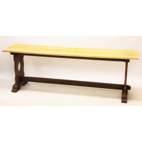 866 - An oak refectory style side table, early 20th century, the stripped rectangular top raised upon tres... 