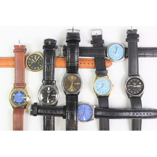 111A - A collection of eight Seiko 5 wristwatches, all with day date apertures, all with alternating baton ... 