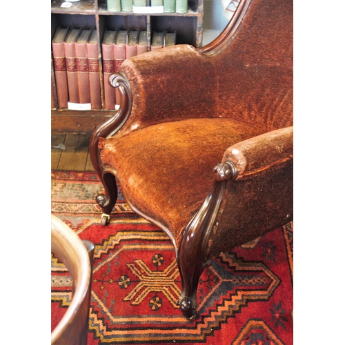 849 - A Victorian mahogany framed drawing room chair, the arched padded back above a serpentine seat flank... 