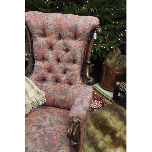 815 - A near pair of William IV mahogany framed armchairs, each chair with a padded button back flanked by... 