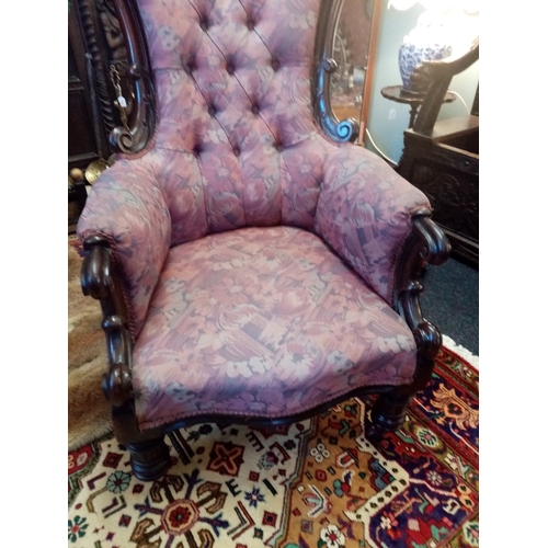 815 - A near pair of William IV mahogany framed armchairs, each chair with a padded button back flanked by... 