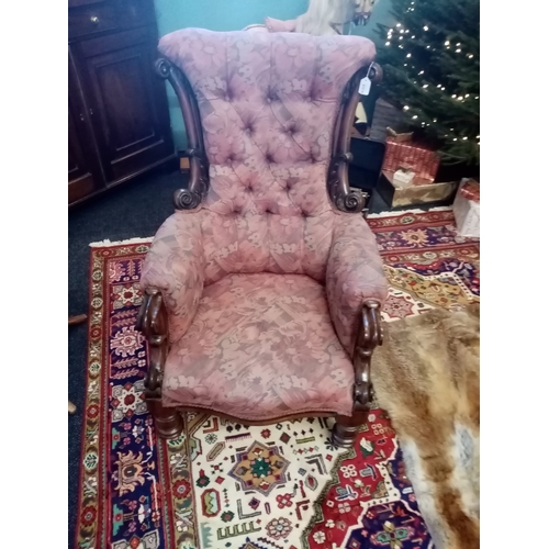 815 - A near pair of William IV mahogany framed armchairs, each chair with a padded button back flanked by... 