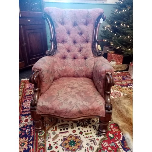 815 - A near pair of William IV mahogany framed armchairs, each chair with a padded button back flanked by... 