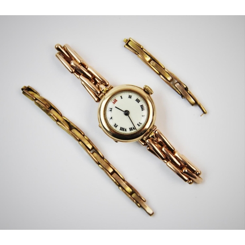 107 - A lady's 9ct gold wristwatch, London 1920-21, the circular white enamel dial with black Roman numera... 