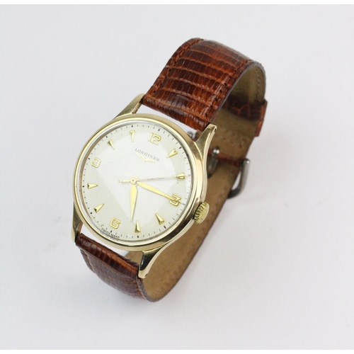 128 - A Longines 9ct gold wristwatch, the round cream coloured dial with gold toned Arabic numerals and ba... 