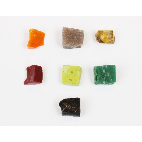 130 - Assorted rough natural gem fragments, to include approx. 246 carats of sapphires, approx. 34 carats ... 