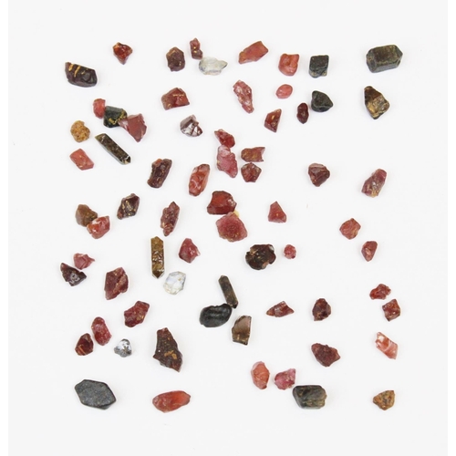 130 - Assorted rough natural gem fragments, to include approx. 246 carats of sapphires, approx. 34 carats ... 