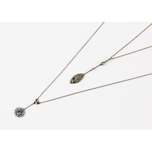 132 - A stone set floral motif drop pendant, comprising a central blue eight-cut paste stone with a cluste... 