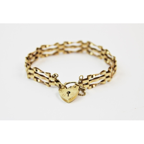 136 - A 9ct gold gatelink bracelet, London 1977, with attached 9ct gold padlock clasp and safety chain, 16... 