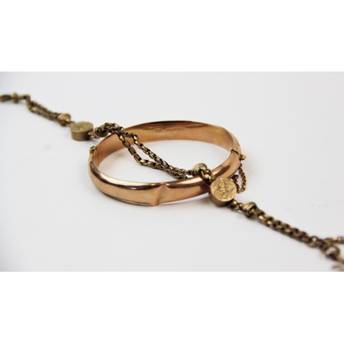 139 - A 9ct gold hinged bangle, Birmingham 1942-43, with foliate relief design, bayonet clasp and safety c... 