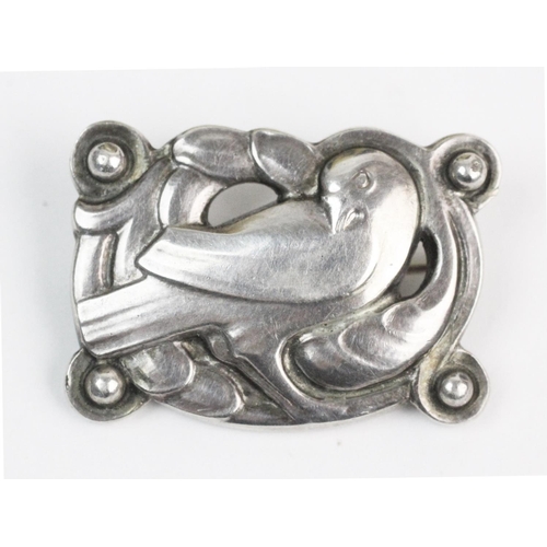 151 - A Georg Jensen silver dove brooch, the pierced design brooch measuring 3cm x 2.2cm, hinged pin and s... 