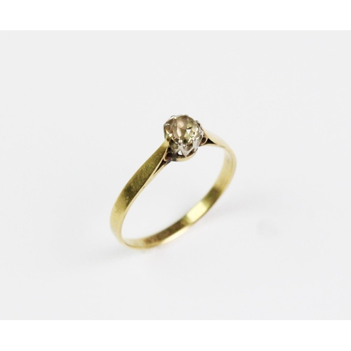 175 - A diamond solitaire ring, the central old cut diamond claw set in white metal, set to tapering yello... 