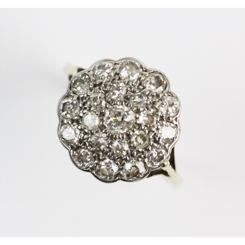 188 - A diamond set floral cluster ring, comprising, 21 old cut and single cut diamonds all set in a scall... 