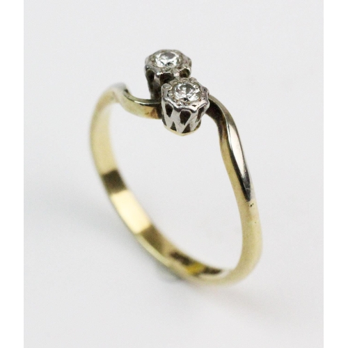 189 - A two-stone diamond ring, comprising two brilliant cut diamonds in white metal illusion settings, co... 