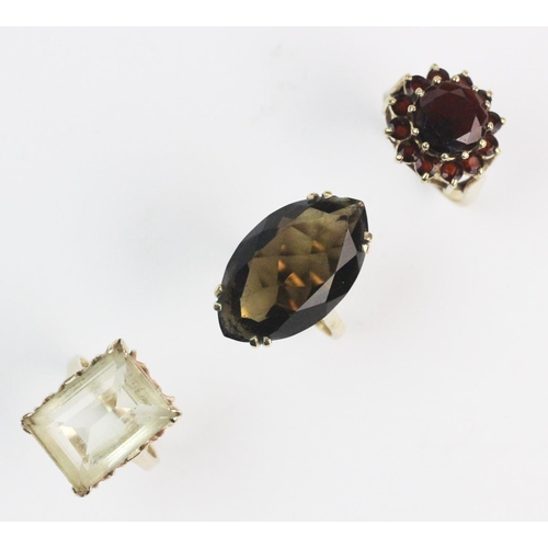 191 - A citrine set dress ring, the step-cut citrine measuring approx. 18mm x 15mm, claw set in yellow met... 