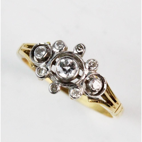 192 - A diamond set 18ct gold cluster ring, comprising, a central brilliant cut diamond weighing approx. 0... 