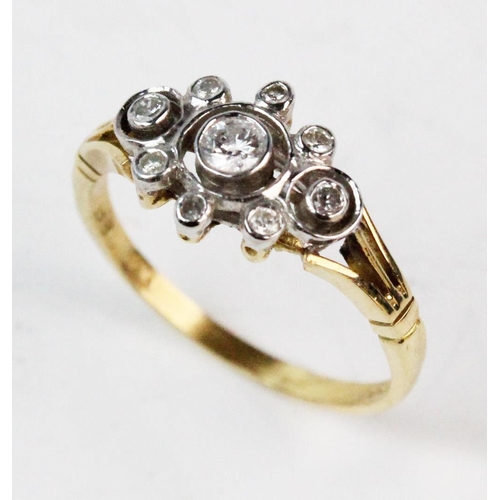 192 - A diamond set 18ct gold cluster ring, comprising, a central brilliant cut diamond weighing approx. 0... 