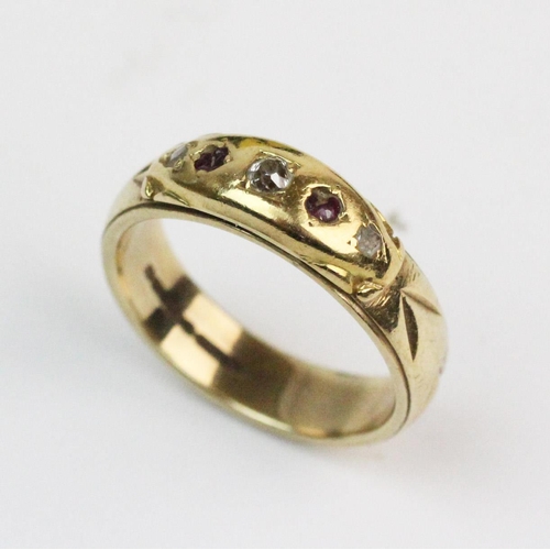 193 - A 9ct gold diamond and ruby set ring, comprising a small old cut diamond with a single cut diamond a... 